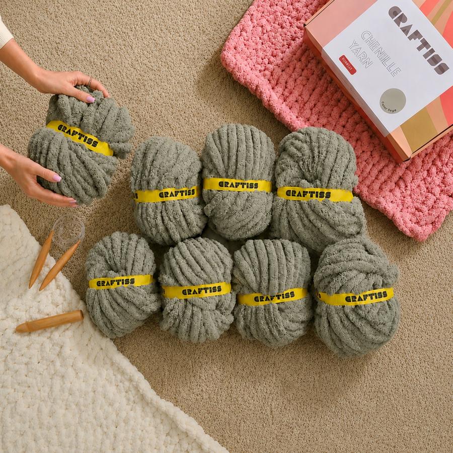 CRAFTISS chunky chenille yarn rolls arranged with blanket materials